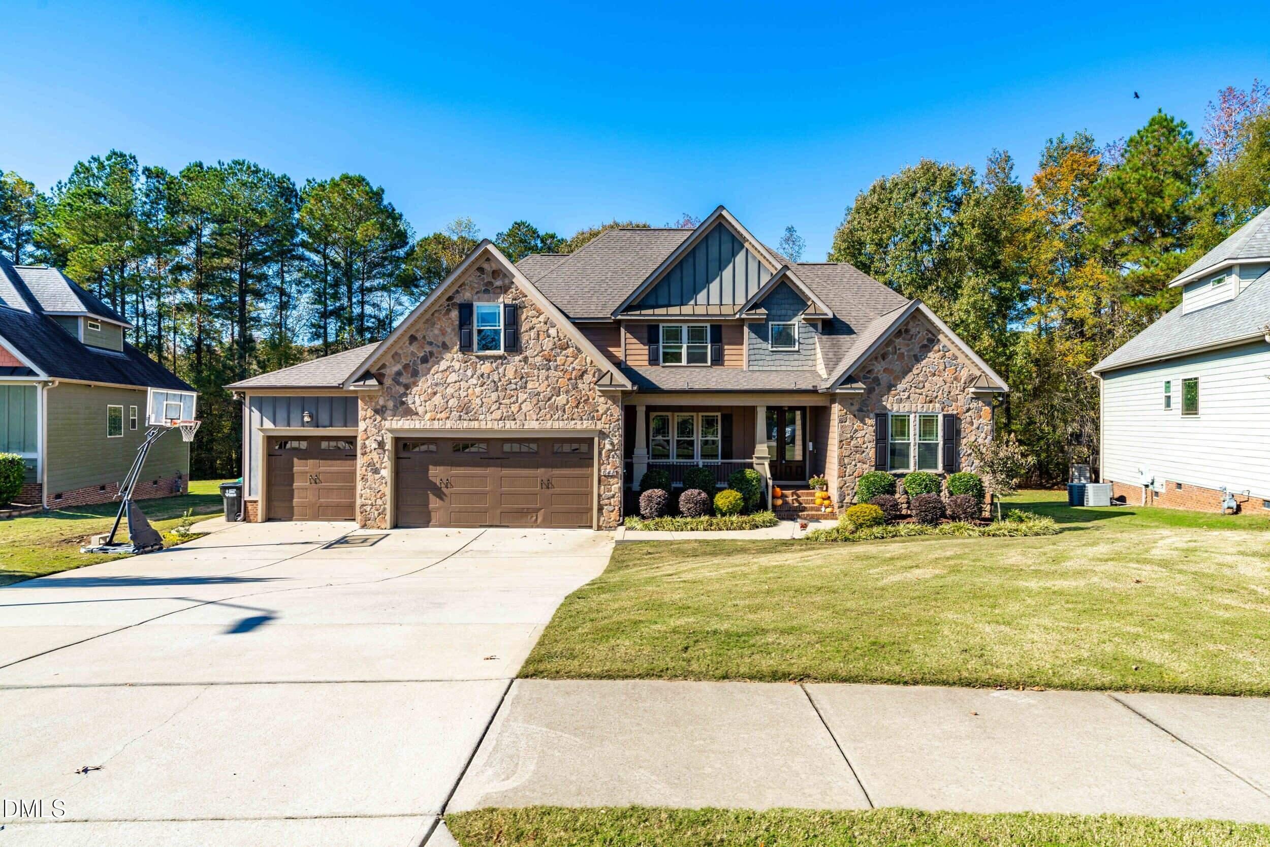648 Fieldtrial Circle Garner, NC 27529 - Photo 6 of 56 a front view of a house with a yard