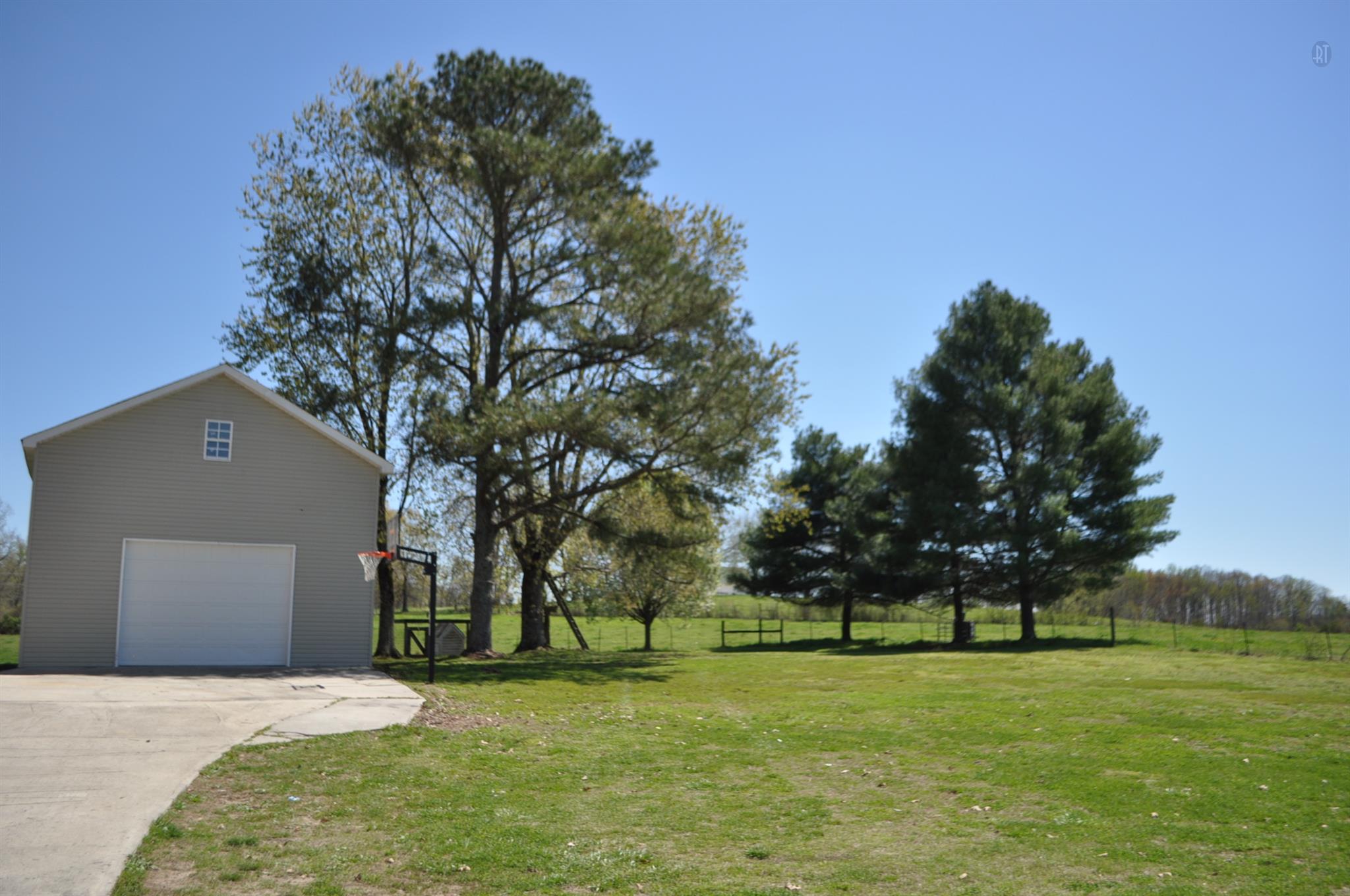 150 Crystal Springs Road Kelso, TN 37348 - Photo 1 of 21 a house with trees in the background