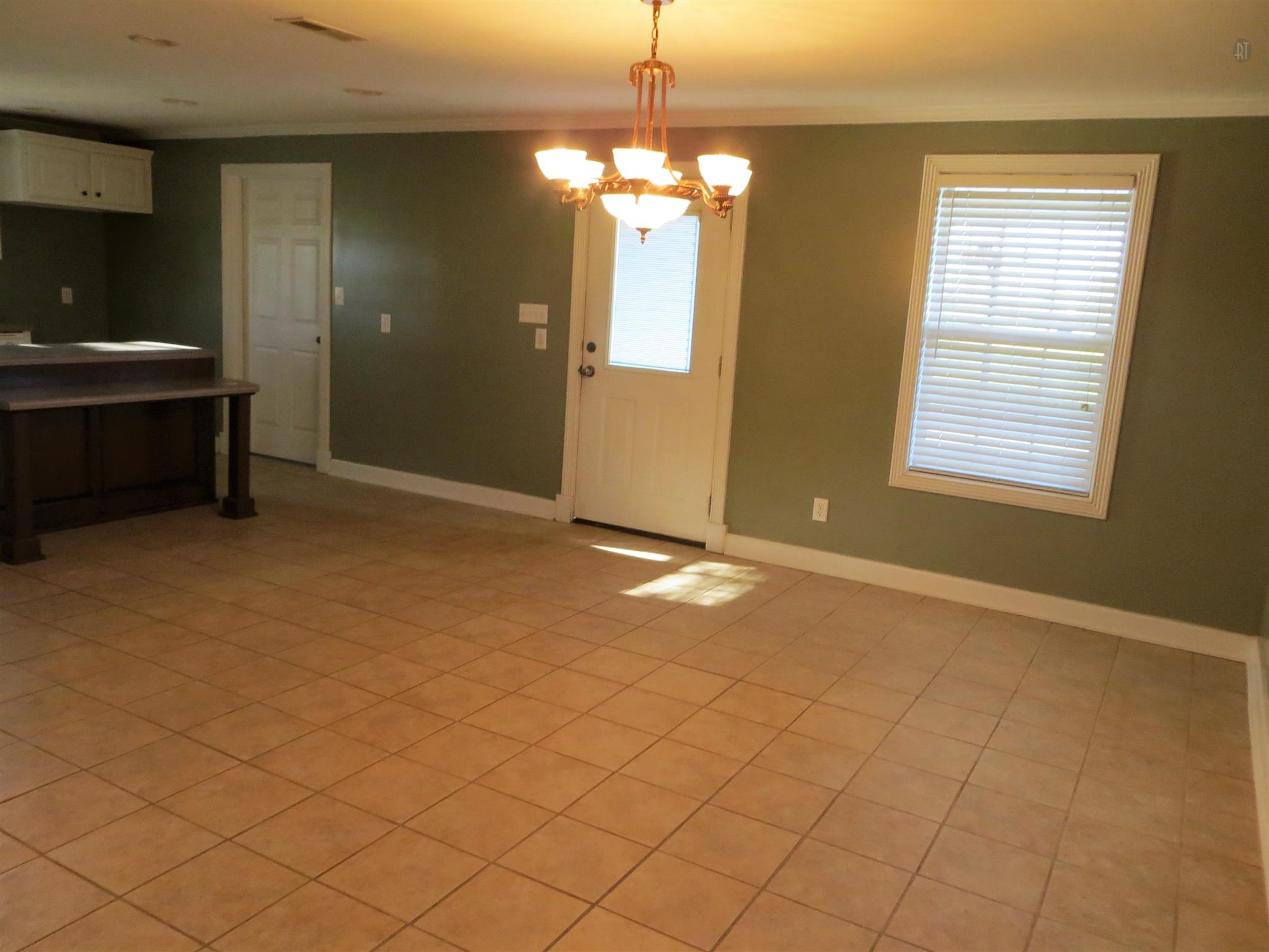150 Crystal Springs Road Kelso, TN 37348 - Photo 11 of 21 a view of a livingroom with a chandelier furniture and windows