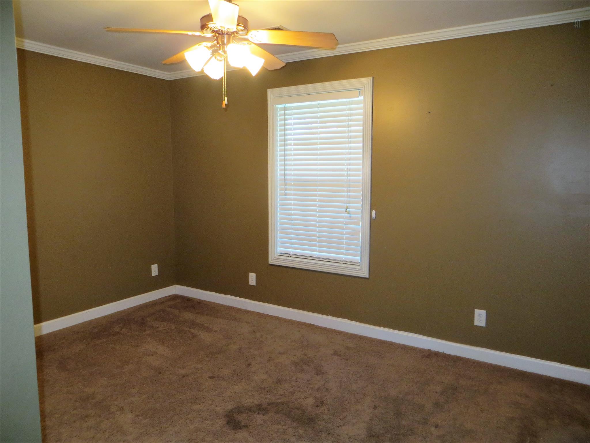 150 Crystal Springs Road Kelso, TN 37348 - Photo 12 of 21 an empty room with a window and a fan