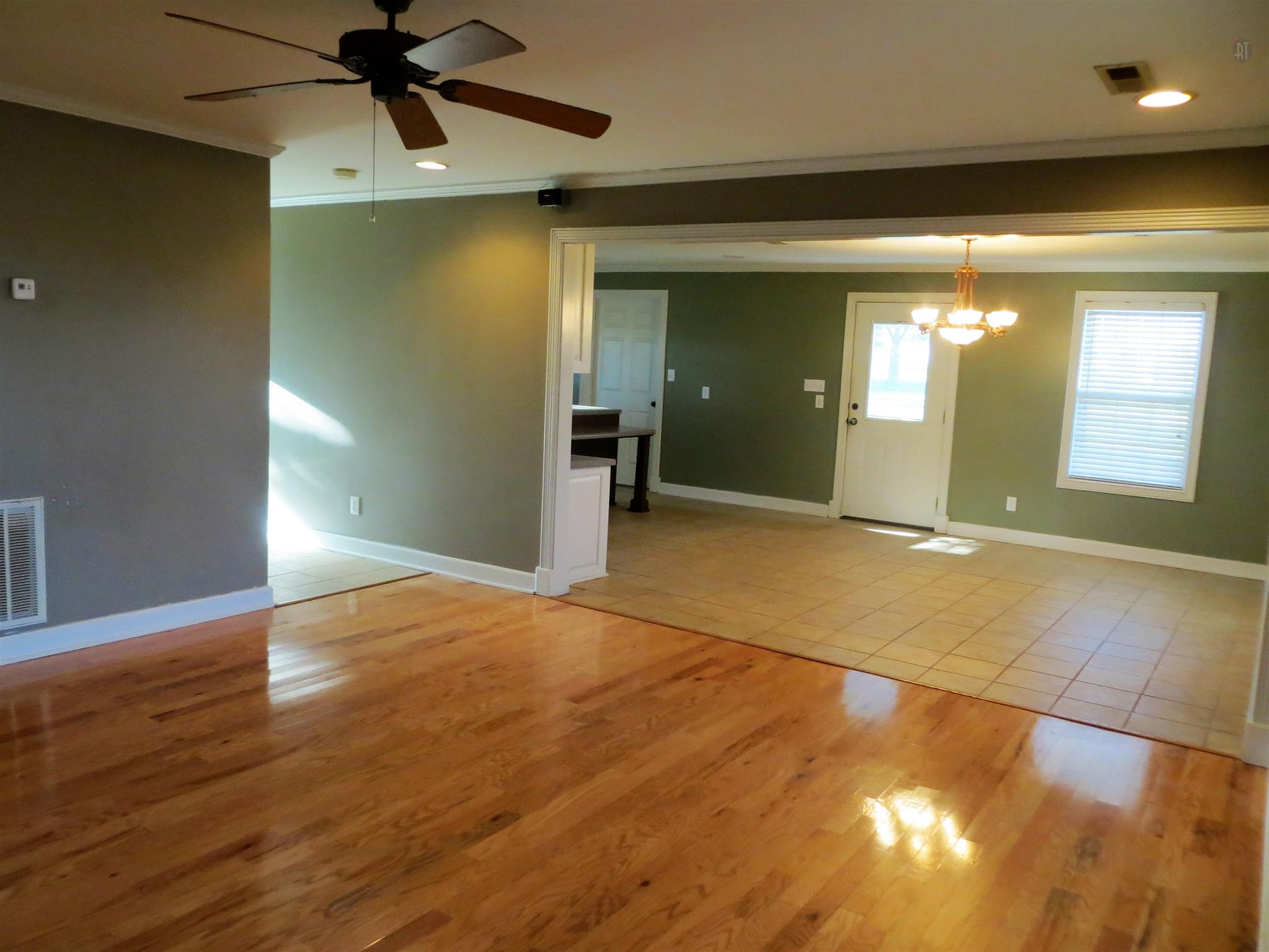 150 Crystal Springs Road Kelso, TN 37348 - Photo 20 of 21 an empty room with wooden floor and windows