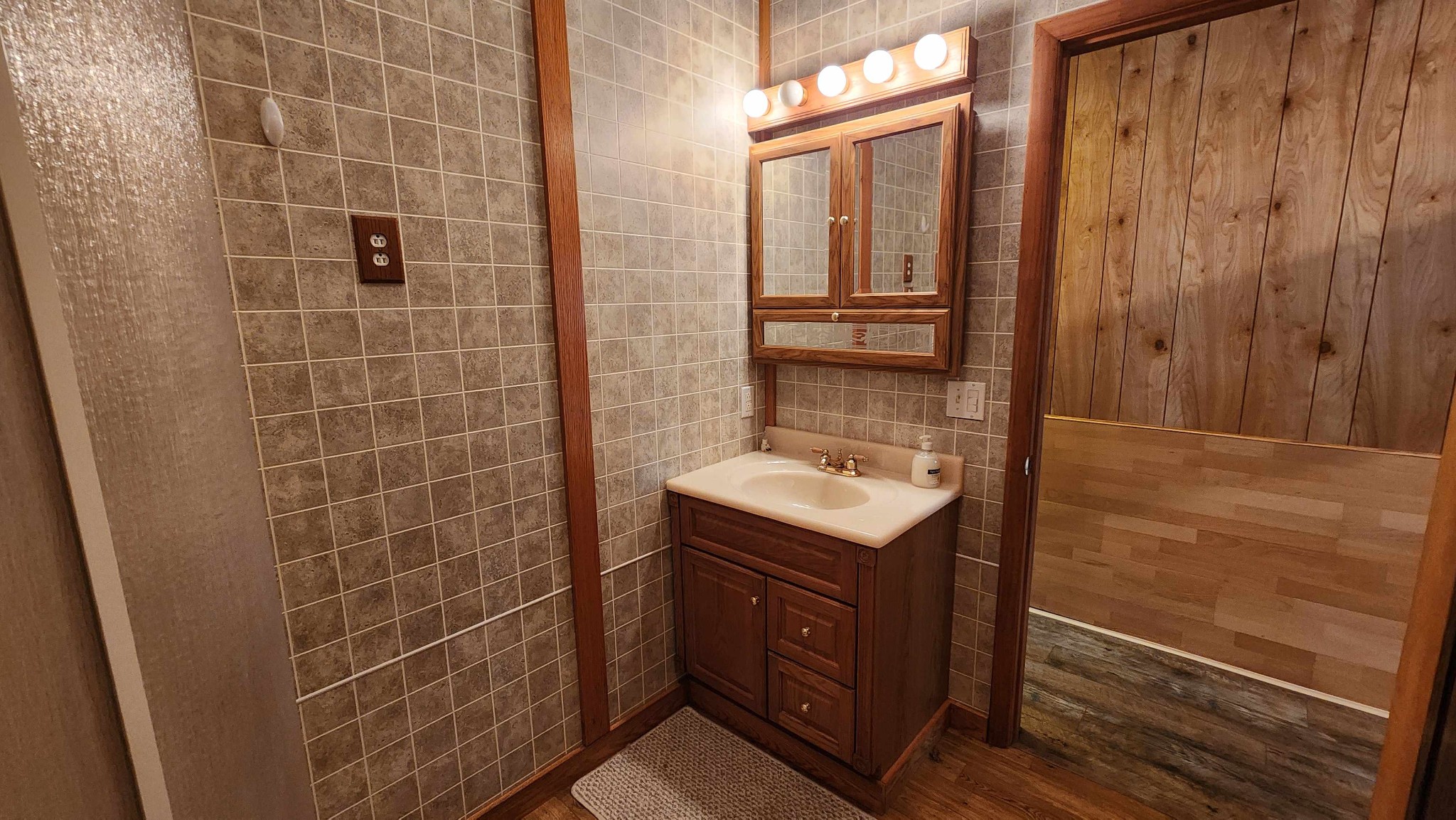 348 Bill Hunter Road Celina, TN 38551 - Photo 14 of 49 a bathroom with a sink toilet and shower