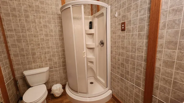 a white toilet sitting next to a bathroom sink