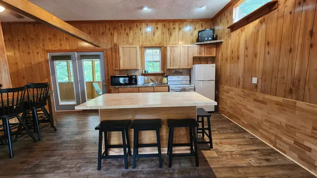 a dining room with furniture window and wooden floor