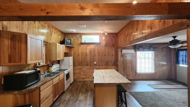 a kitchen with a sink stove and cabinets