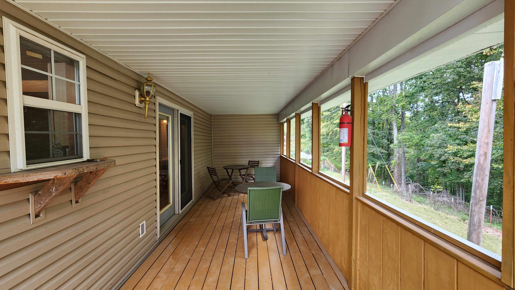 348 Bill Hunter Road Celina, TN 38551 - Photo 37 of 49 a view of a balcony with chairs and wooden floor