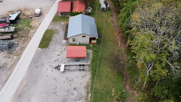 an aerial view of a house with a garden