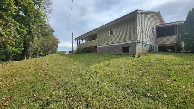 a view of a house with a yard