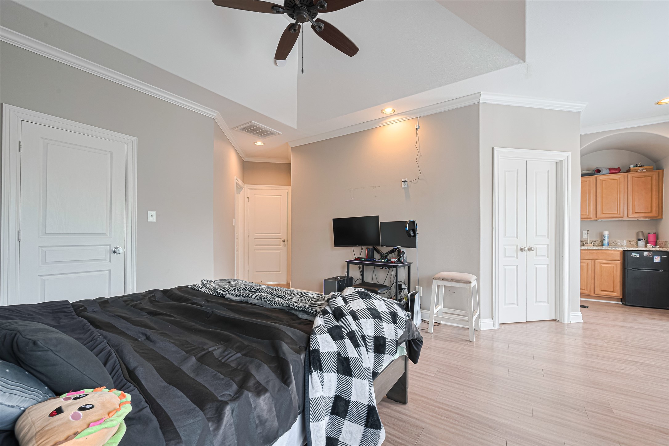 24 Versante Court Houston, TX 77070 - Photo 12 of 30 a bedroom with a bed and wooden floor