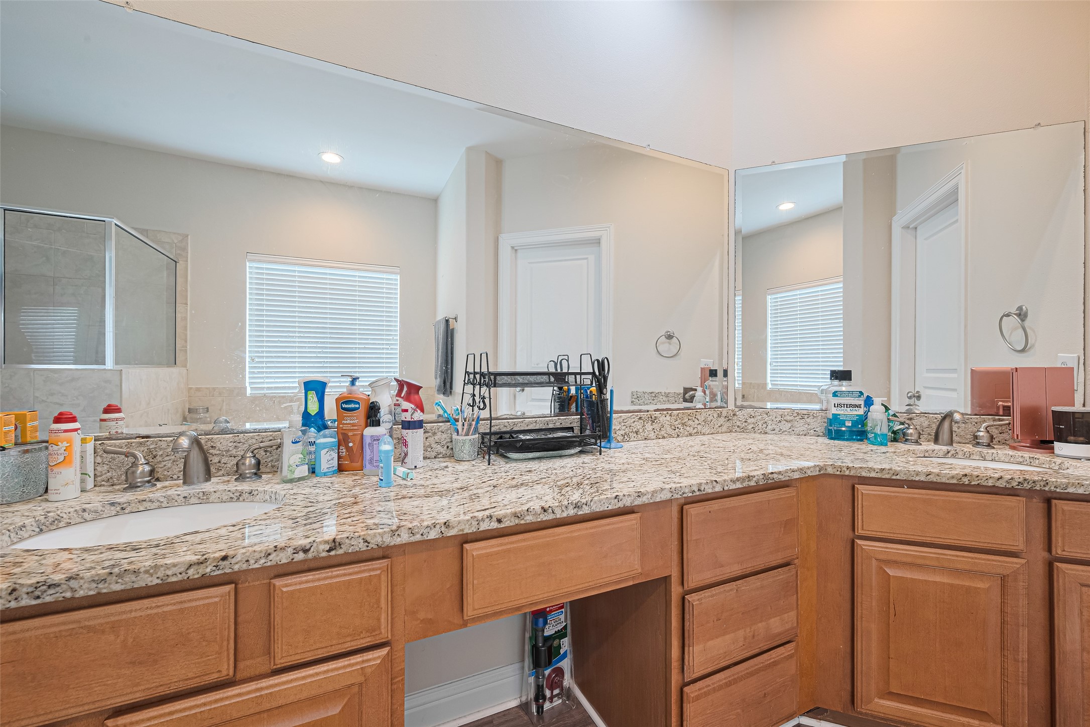 24 Versante Court Houston, TX 77070 - Photo 14 of 30 a kitchen with granite countertop a sink and a granite counter tops