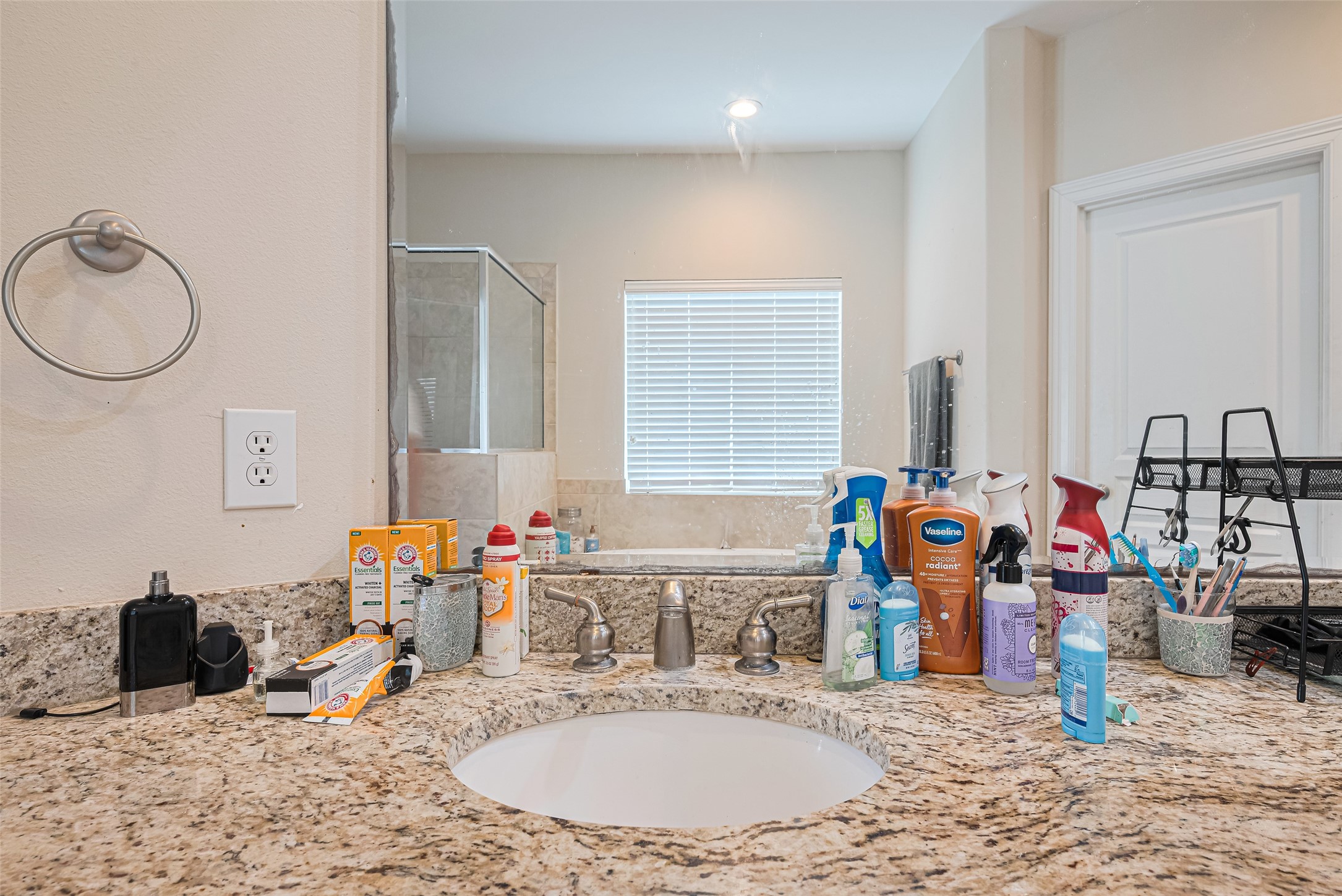 24 Versante Court Houston, TX 77070 - Photo 15 of 30 a bathroom with sink and a mirror