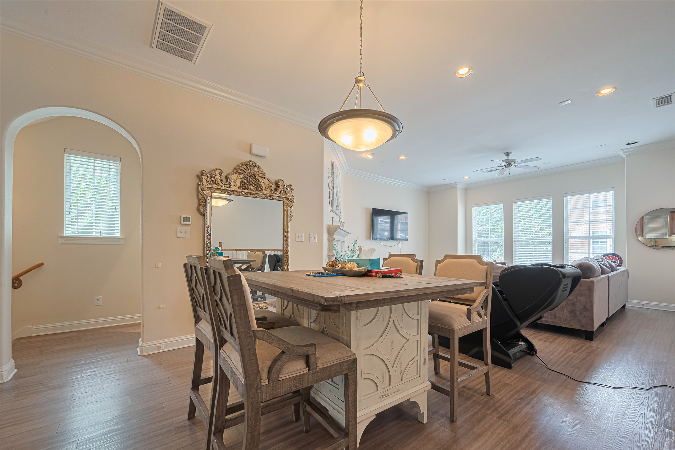 24 Versante Court Houston, TX 77070 - Photo 19 of 30 a view of a dining room with furniture and wooden floor