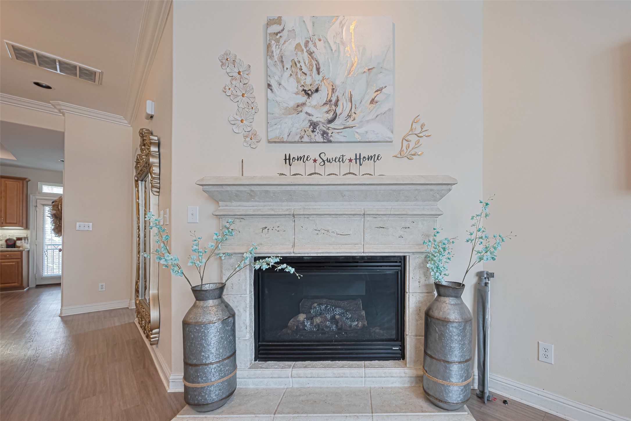 24 Versante Court Houston, TX 77070 - Photo 2 of 30 a living room with a fireplace and a table
