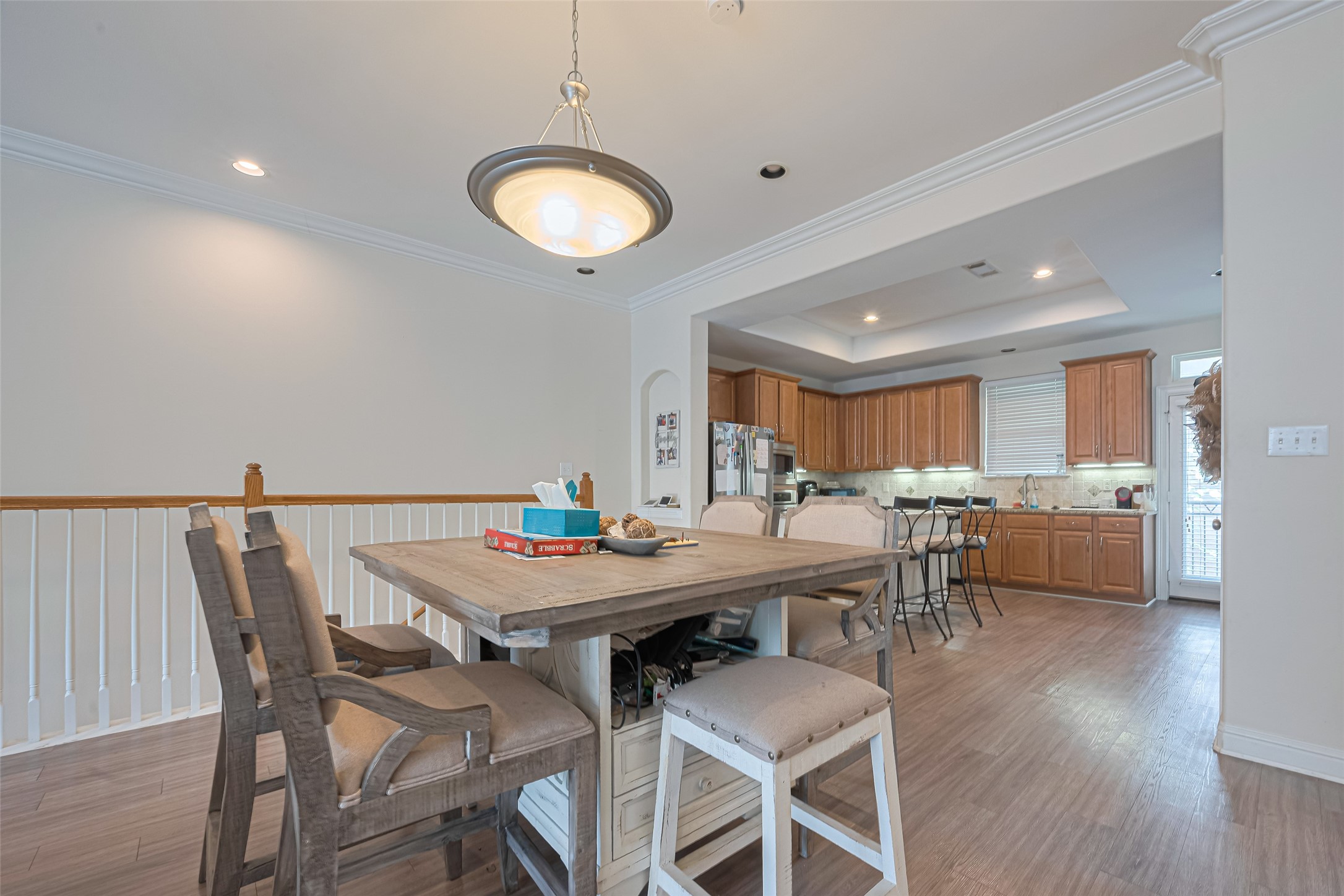 24 Versante Court Houston, TX 77070 - Photo 21 of 30 a view of a dining room with furniture and wooden floor