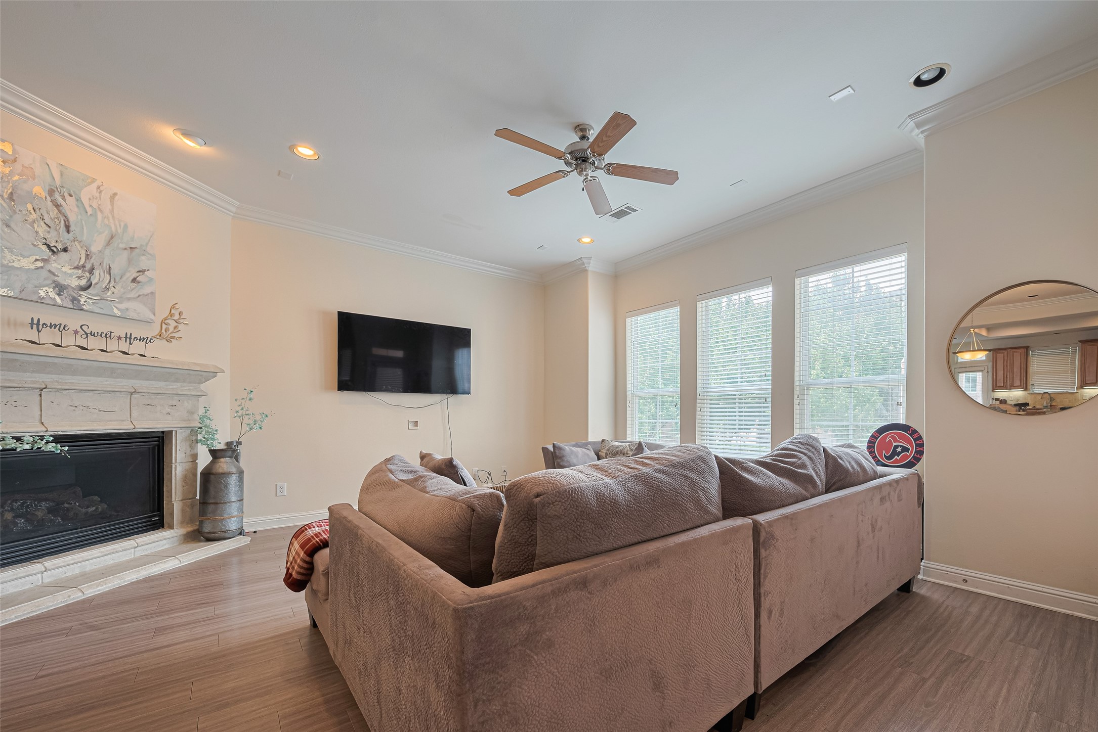 24 Versante Court Houston, TX 77070 - Photo 23 of 30 a living room with furniture and a fireplace