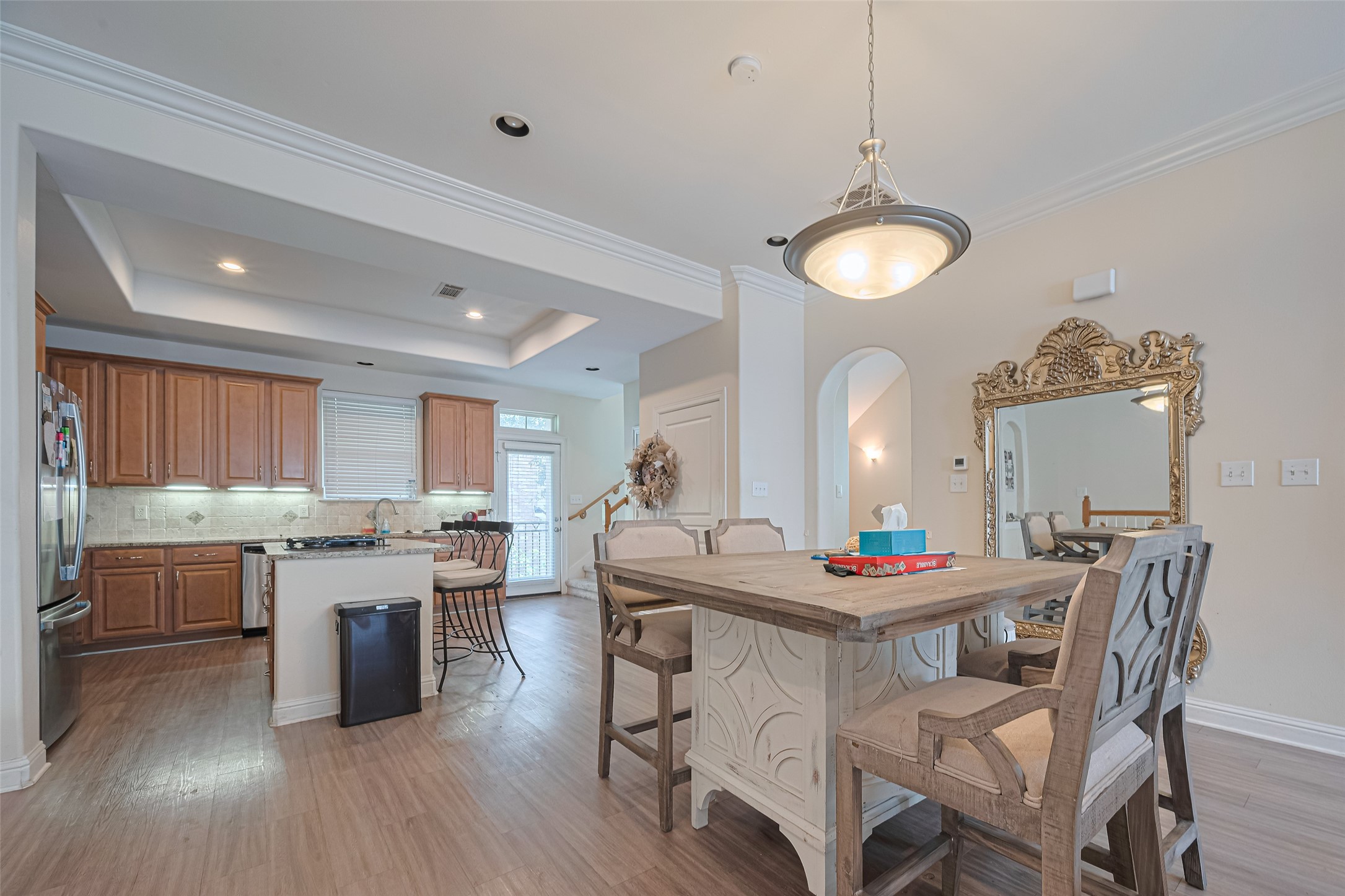 24 Versante Court Houston, TX 77070 - Photo 24 of 30 a kitchen with a table and chairs in it