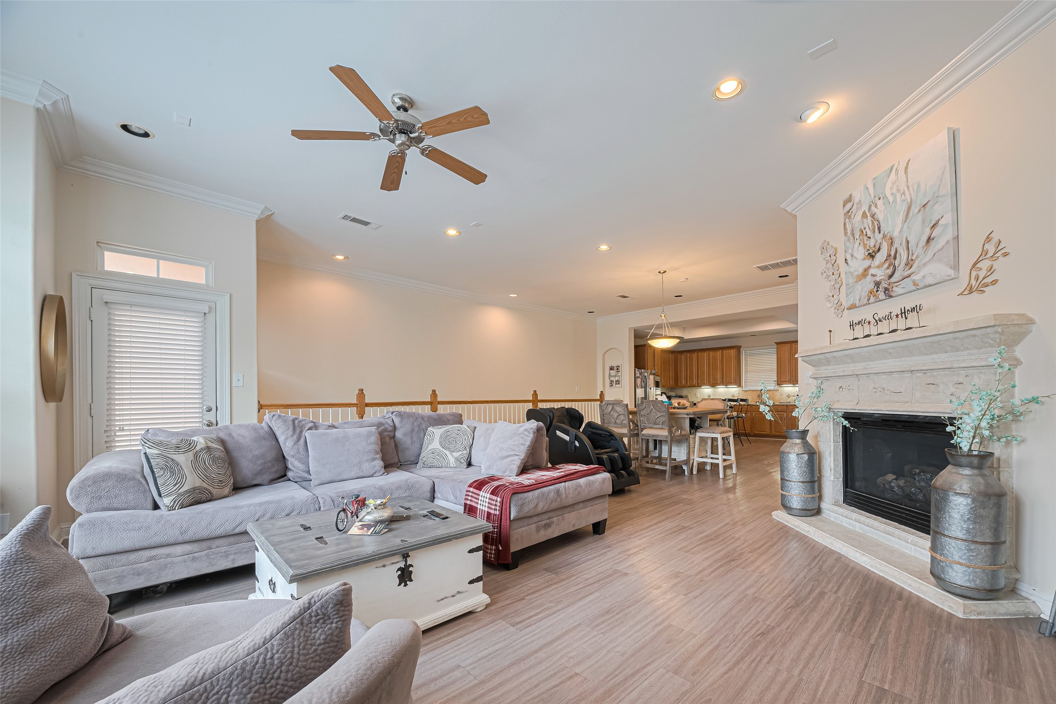 24 Versante Court Houston, TX 77070 - Photo 26 of 30 a living room with furniture and a fireplace