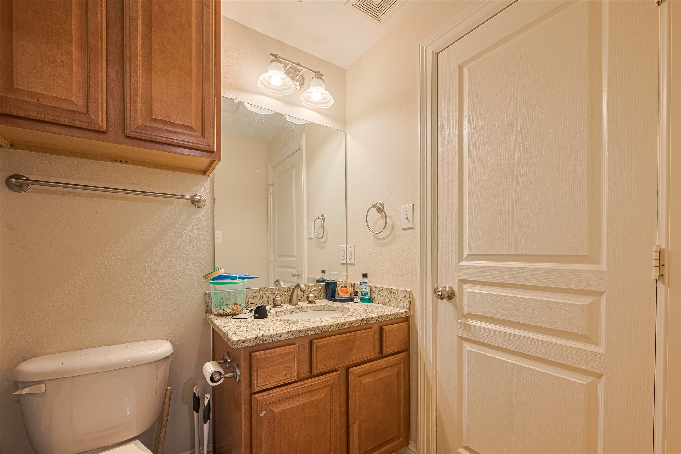 24 Versante Court Houston, TX 77070 - Photo 5 of 30 a bathroom with a sink a toilet and vanity