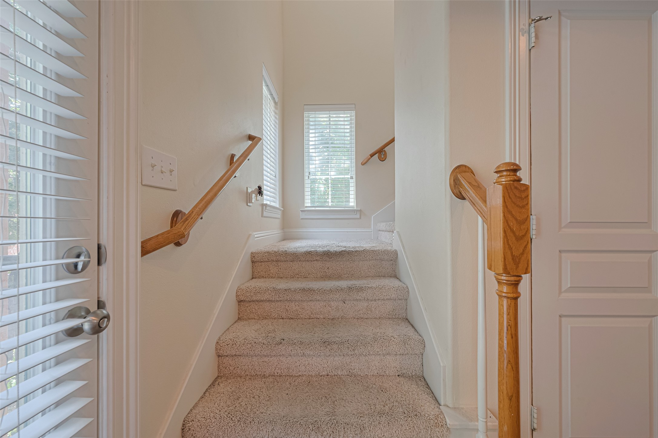 24 Versante Court Houston, TX 77070 - Photo 7 of 30 a view of staircase with white walls and windows