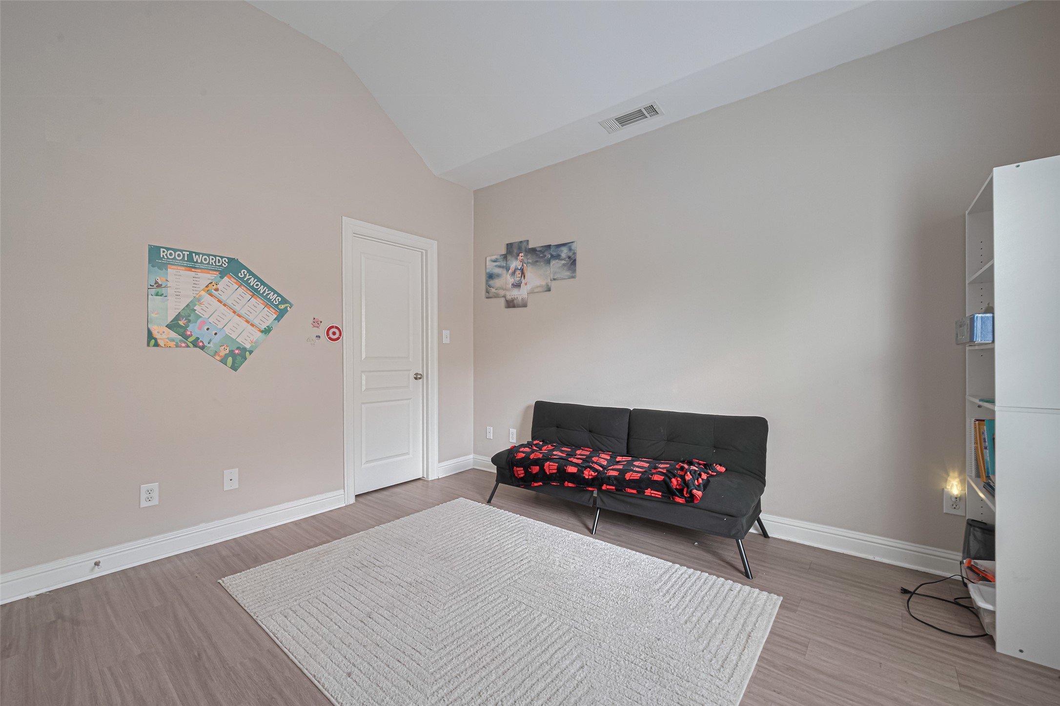 24 Versante Court Houston, TX 77070 - Photo 9 of 30 a hallway with toys and a wooden floor
