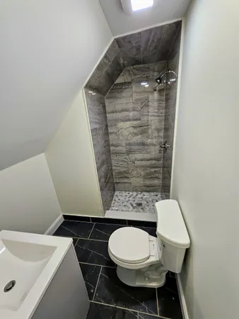 a bathroom with a toilet and a sink