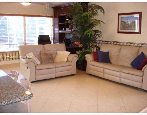10500 Southwest 140th Road Miami, FL 33176 - Photo 11 of 16 a living room with furniture and a large window