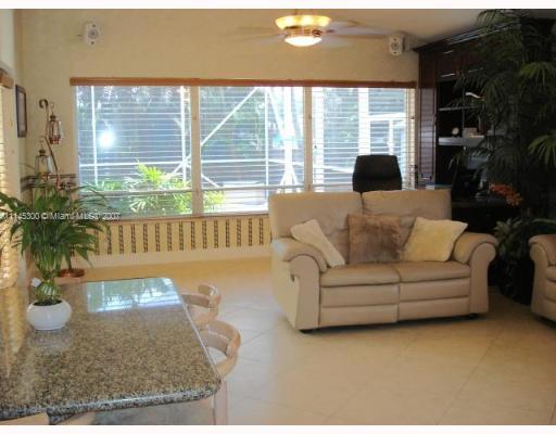 10500 Southwest 140th Road Miami, FL 33176 - Photo 12 of 16 a living room with furniture and a large window