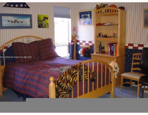 10500 Southwest 140th Road Miami, FL 33176 - Photo 14 of 16 a living room with furniture a rug and a window