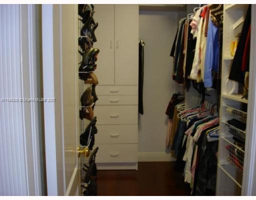 10500 Southwest 140th Road Miami, FL 33176 - Photo 15 of 16 a view of walk in closet with clothes and shoes