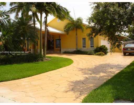 10500 Southwest 140th Road Miami, FL 33176 - Photo 2 of 16 a view of a house with a yard