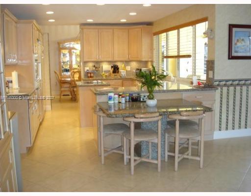 10500 Southwest 140th Road Miami, FL 33176 - Photo 5 of 16 a kitchen with a table and chairs in it