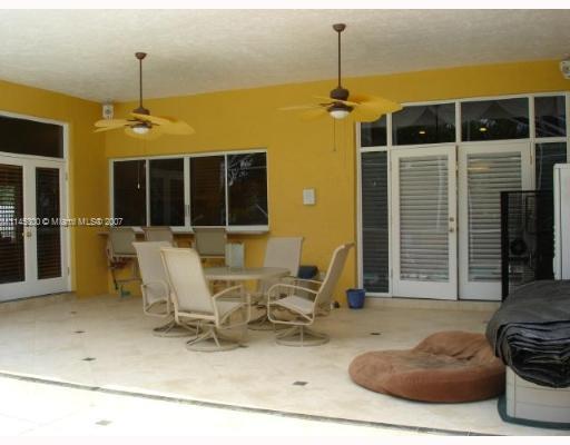 10500 Southwest 140th Road Miami, FL 33176 - Photo 10 of 16 a building outdoor space with patio furniture and potted plants