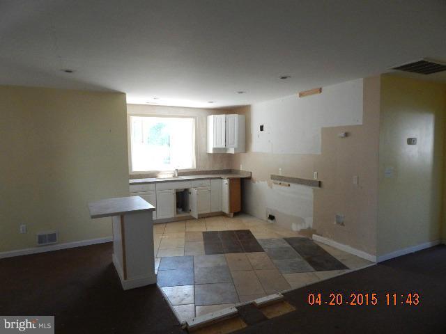 11811 Indigo Road Silver Spring, MD 20906 - Photo 3 of 6 a kitchen with a sink cabinets and window