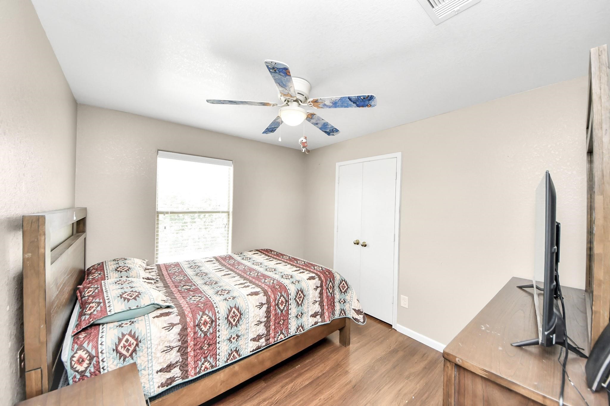 16542 Peyton Ridge Circle Houston, TX 77049 - Photo 12 of 16 a bedroom with a bed and a window