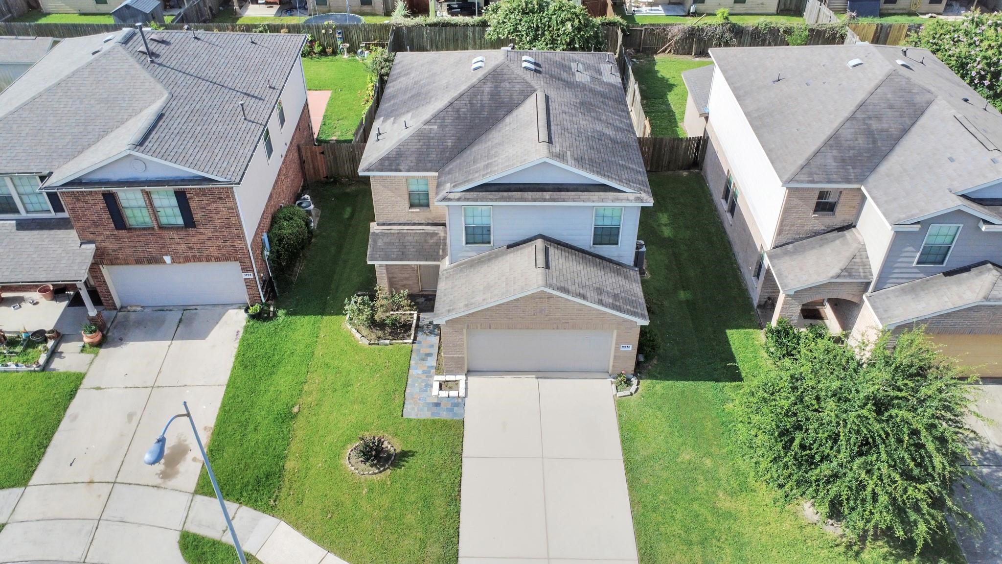 16542 Peyton Ridge Circle Houston, TX 77049 - Photo 3 of 16 an aerial view of a house with a garden