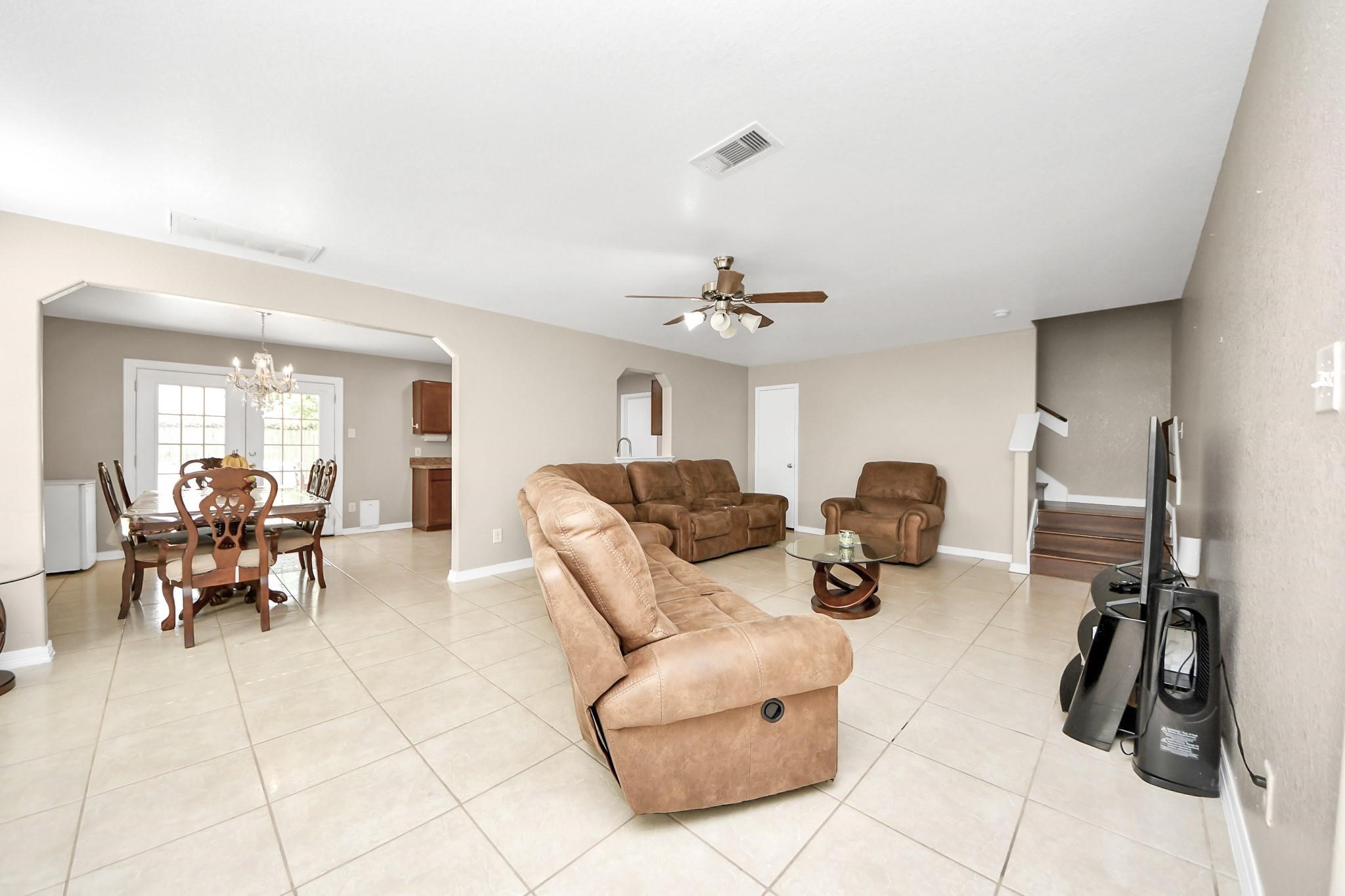 16542 Peyton Ridge Circle Houston, TX 77049 - Photo 6 of 16 a living room with furniture and a flat screen tv