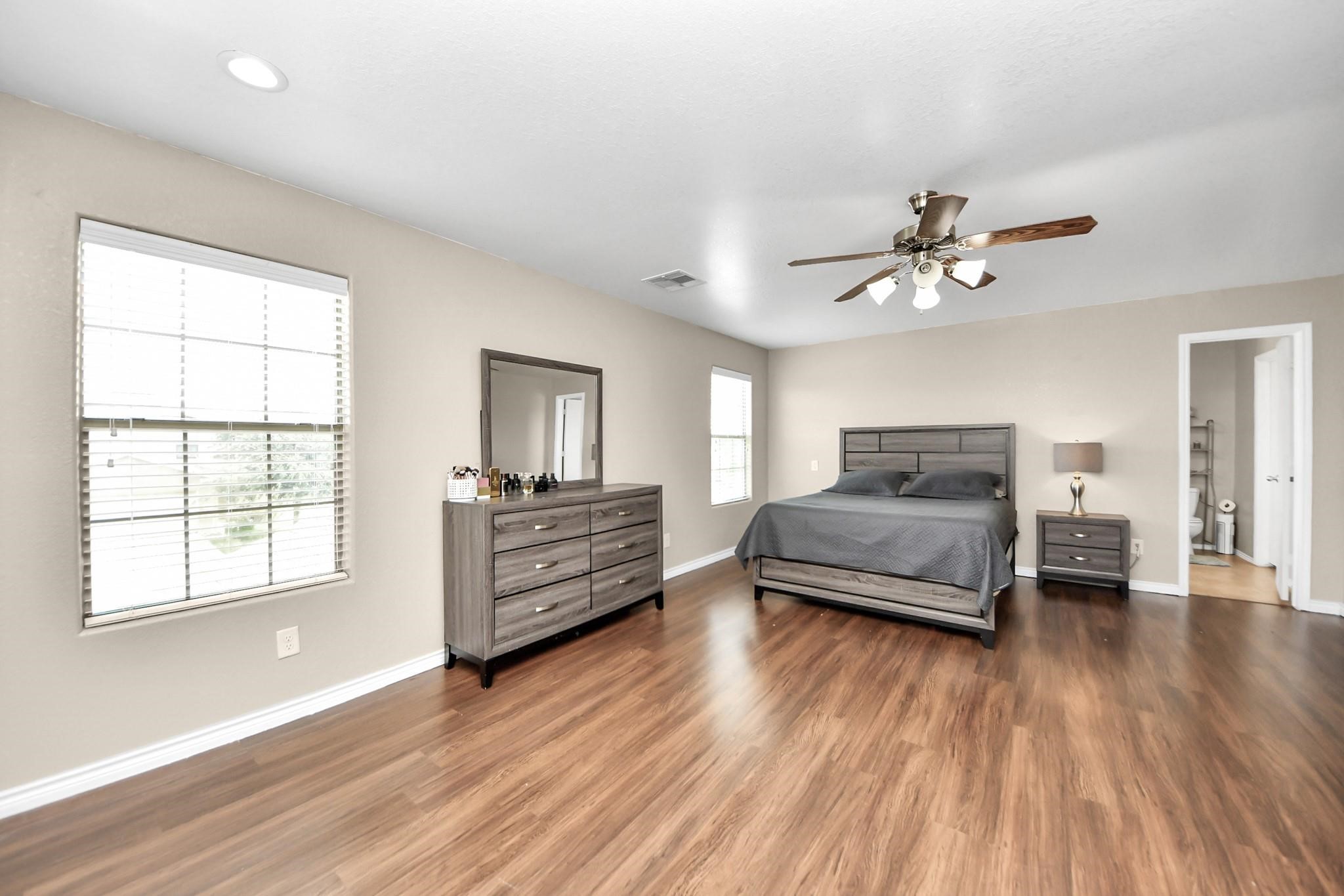 16542 Peyton Ridge Circle Houston, TX 77049 - Photo 10 of 16 a living room with furniture and a wooden floor