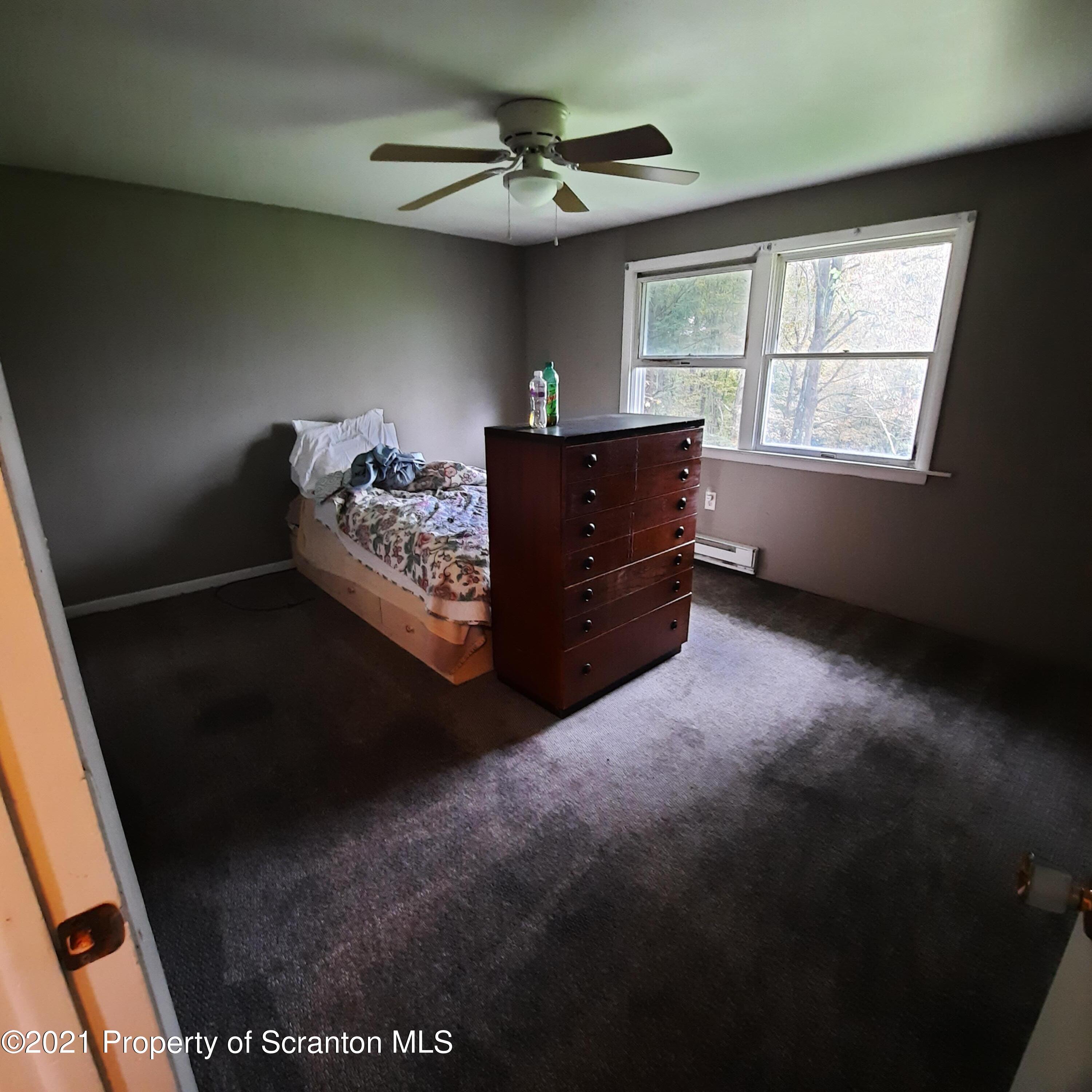 313 Marshal Squire Road Nicholson, PA 18446 - Photo 14 of 21 a living room with furniture and a window