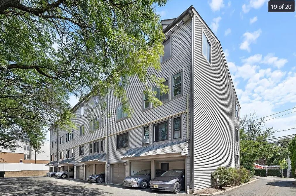a view of a building with a street