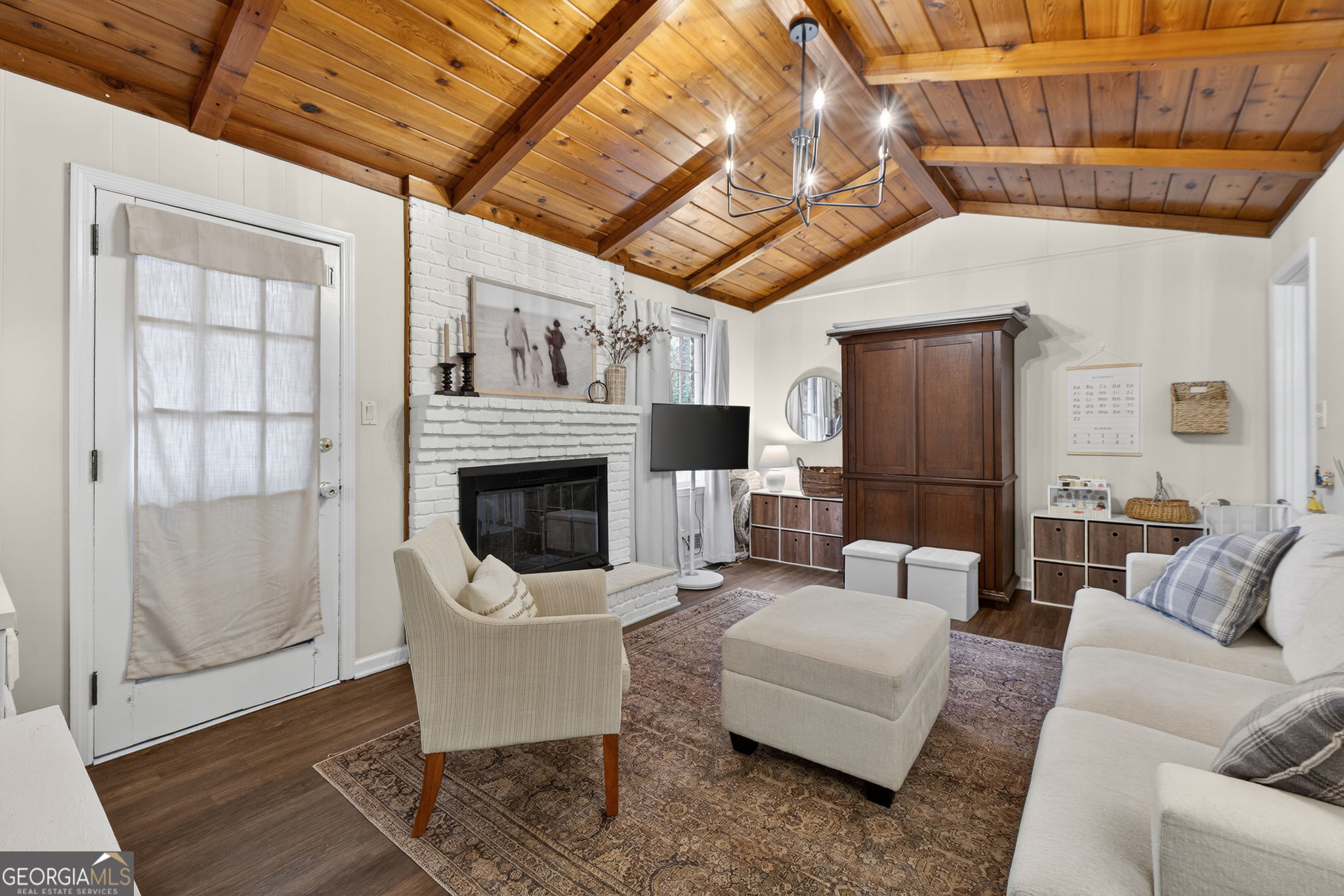 209 Laramie Road Griffin, GA 30224 - Photo 17 of 36 a living room with furniture a fireplace and a table