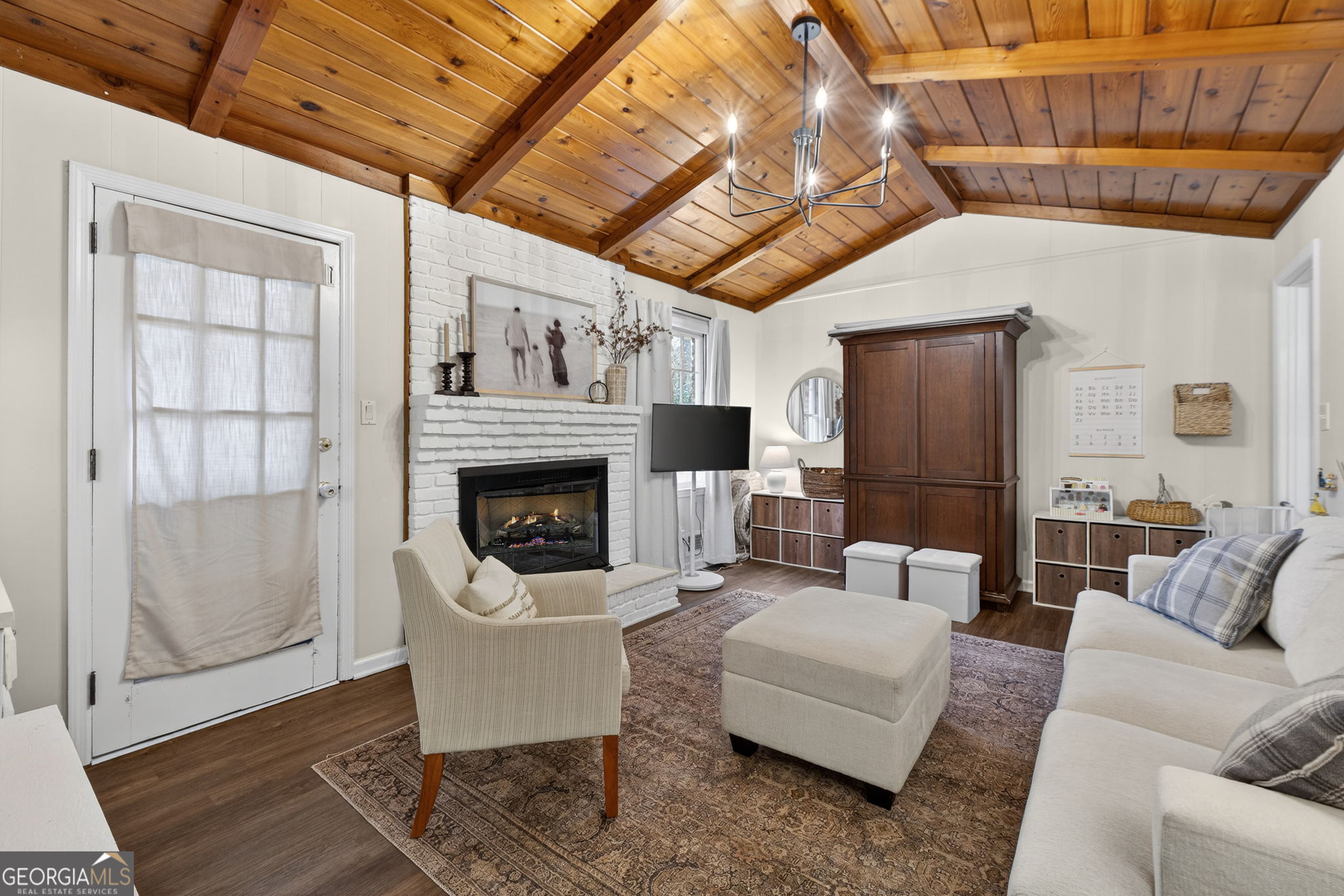 209 Laramie Road Griffin, GA 30224 - Photo 18 of 36 a living room with furniture and a fireplace