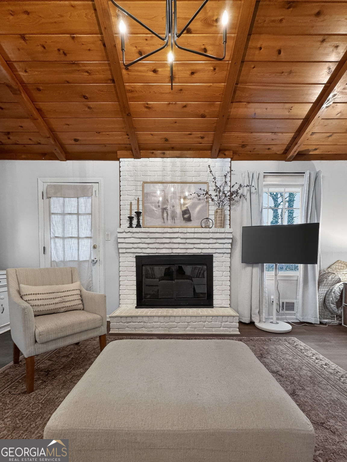 209 Laramie Road Griffin, GA 30224 - Photo 19 of 36 a living room with furniture a fireplace and a window