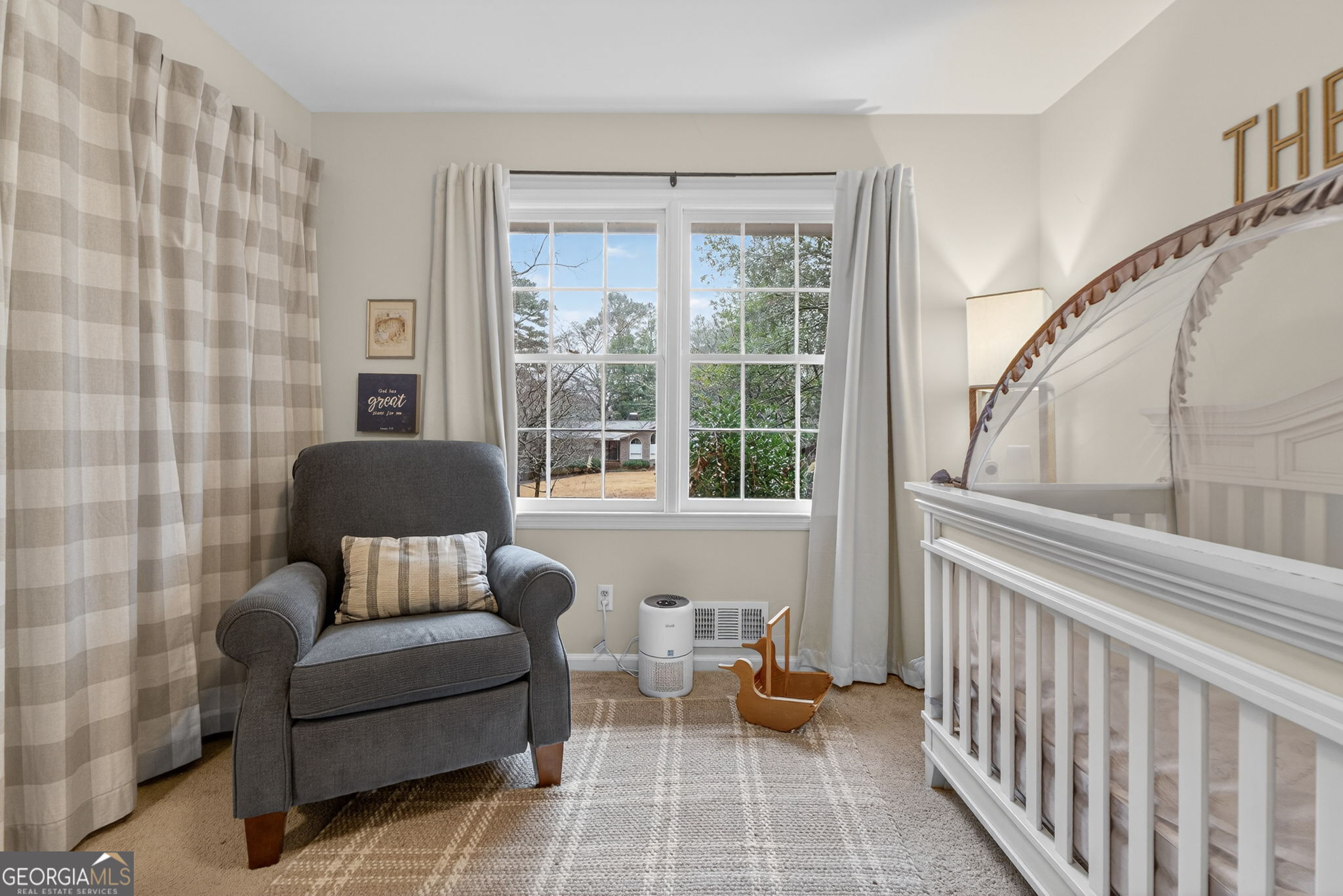 209 Laramie Road Griffin, GA 30224 - Photo 29 of 36 a living room with furniture and a floor to ceiling window