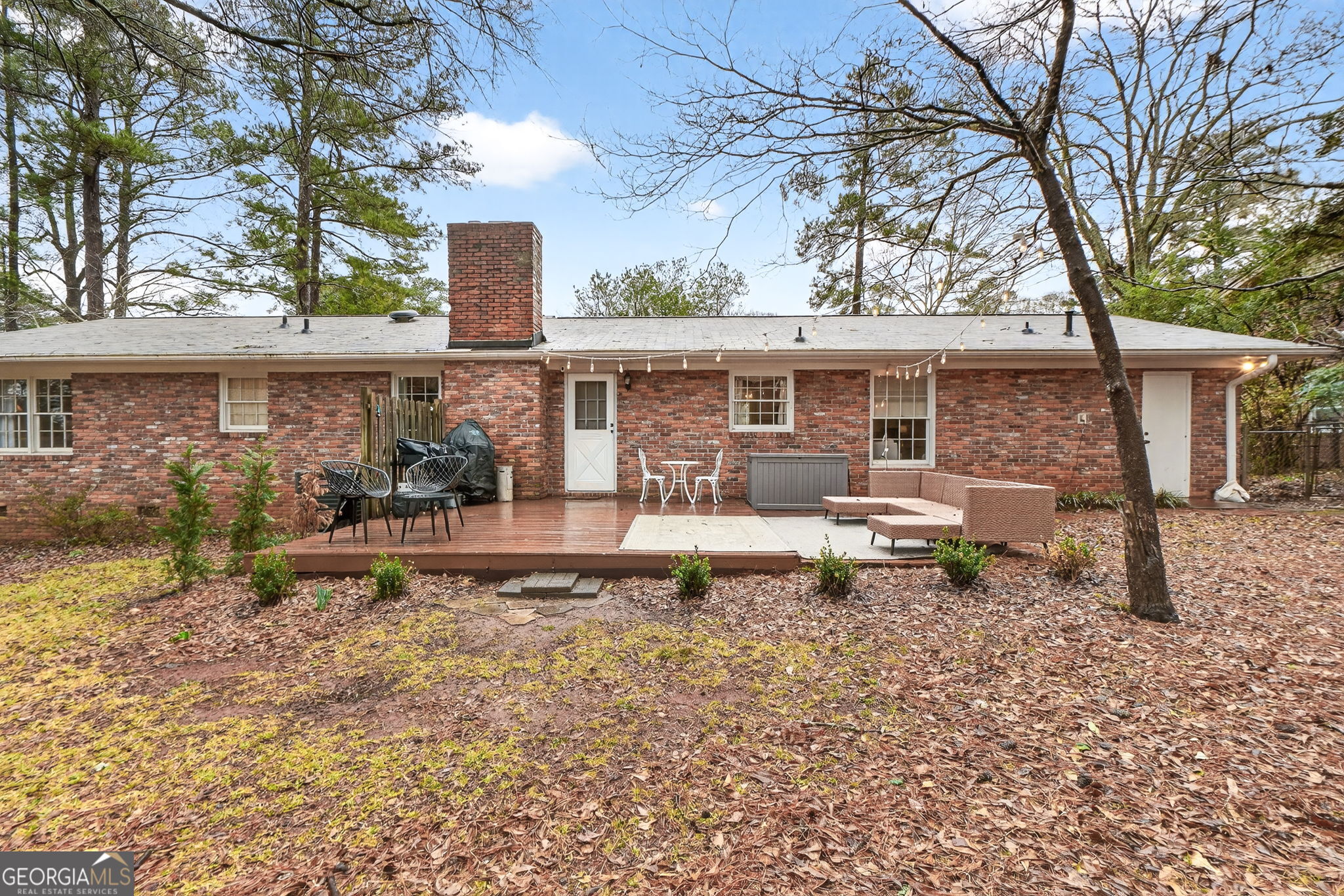 209 Laramie Road Griffin, GA 30224 - Photo 33 of 36 a view of a house with backyard and sitting area
