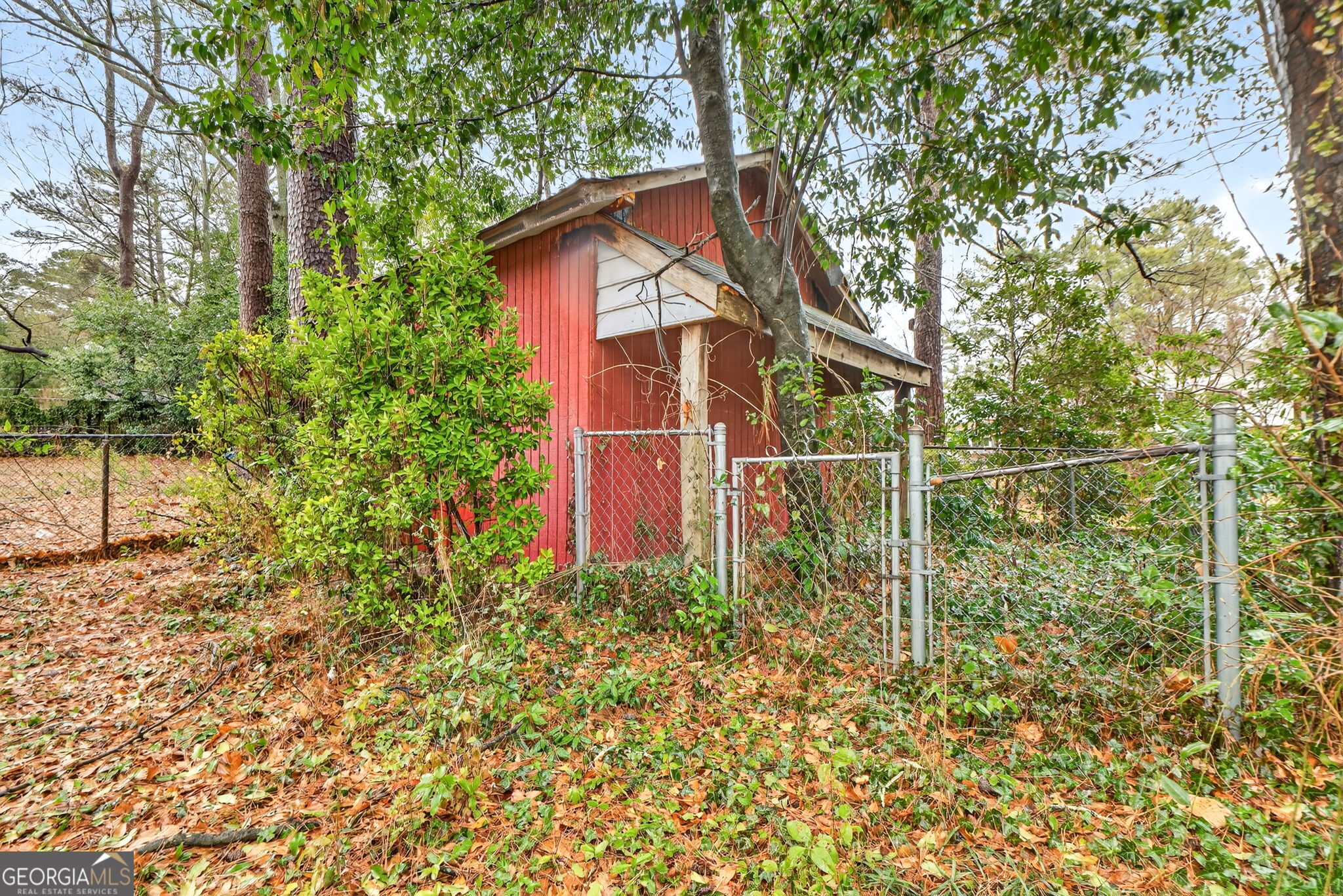 209 Laramie Road Griffin, GA 30224 - Photo 36 of 36 a view of a wooden fence with a tree