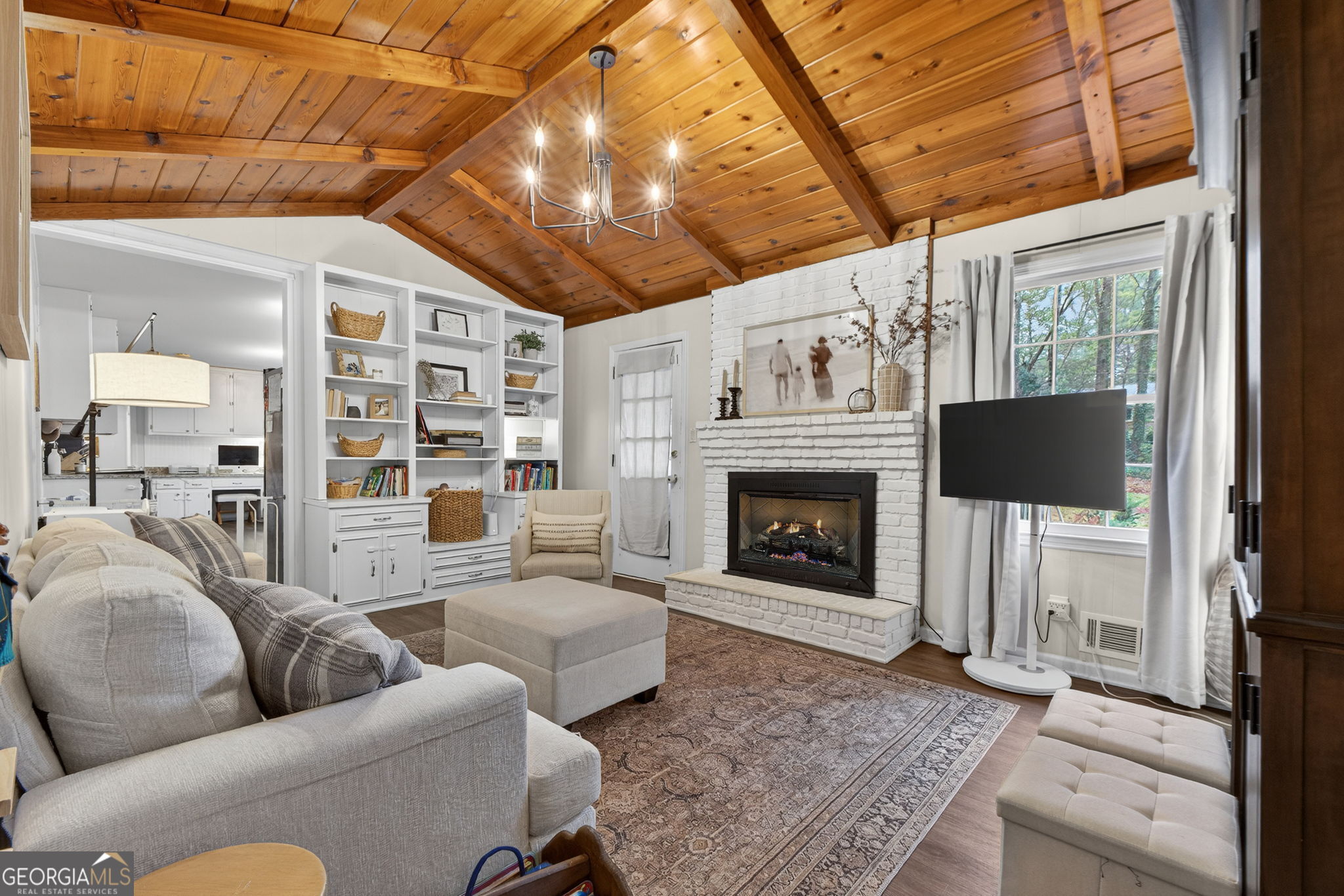 209 Laramie Road Griffin, GA 30224 - Photo 4 of 36 a living room with furniture and a fireplace