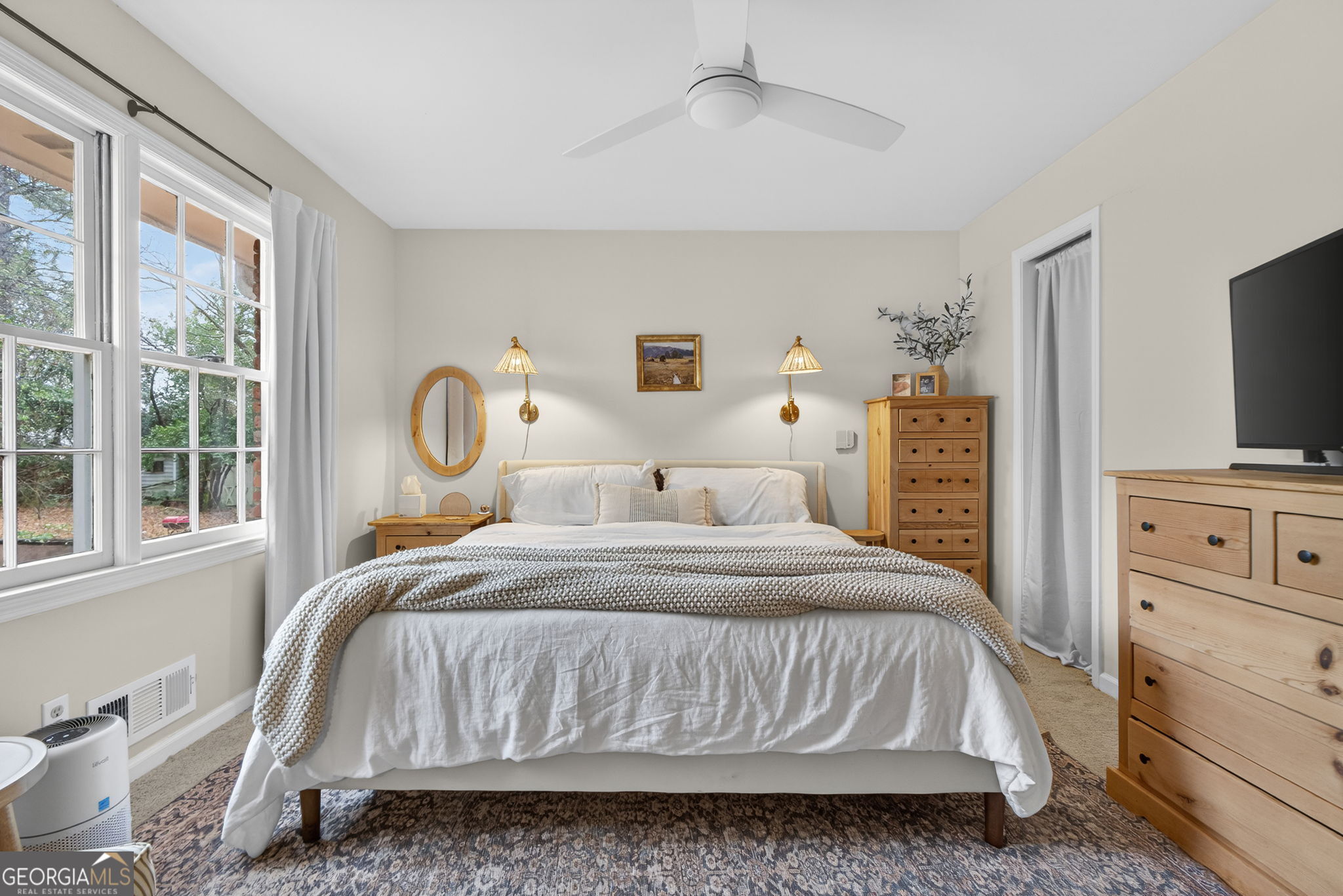 209 Laramie Road Griffin, GA 30224 - Photo 5 of 36 a bedroom with a bed and a flat tv screen on dresser