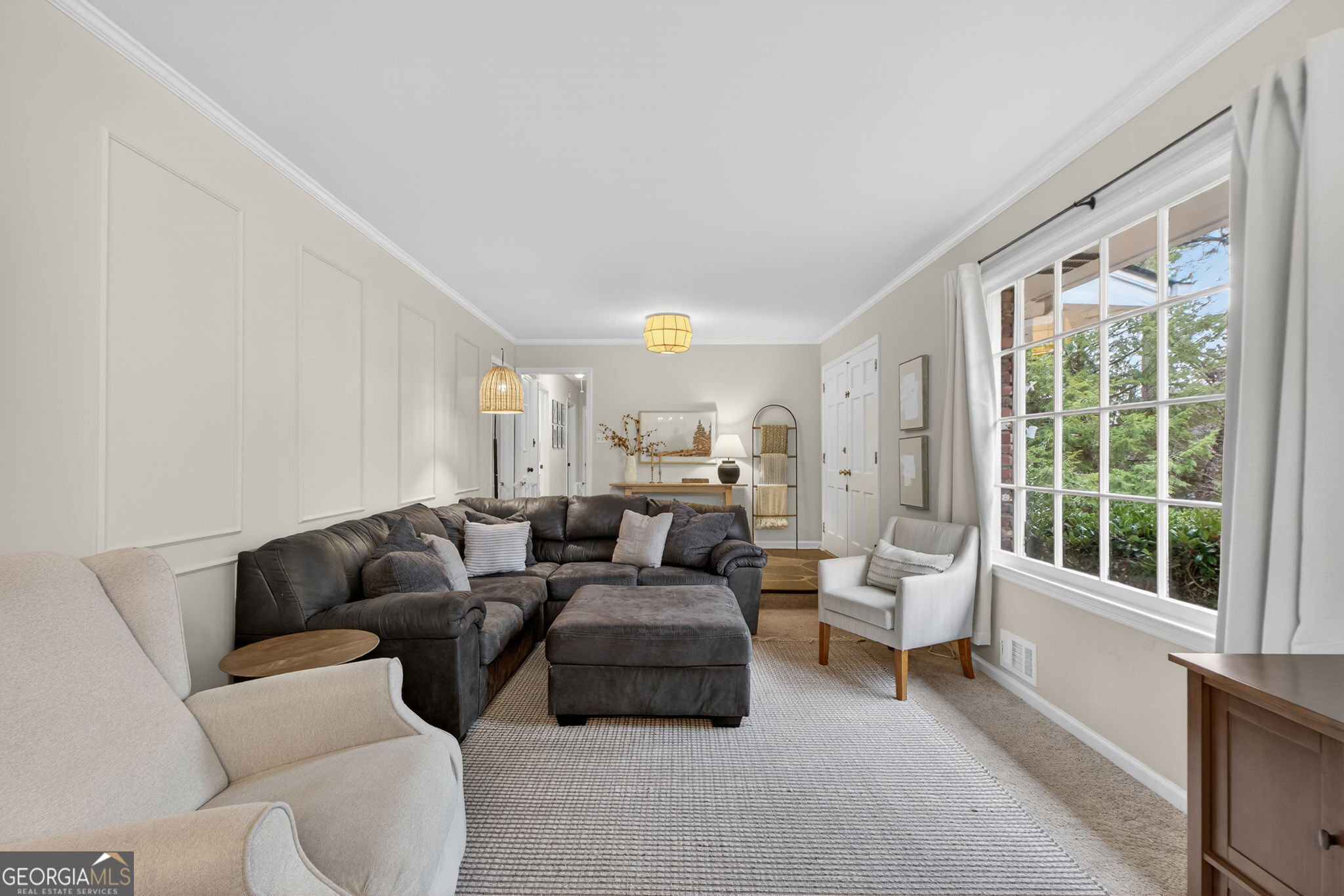 209 Laramie Road Griffin, GA 30224 - Photo 9 of 36 a living room with furniture and a large window