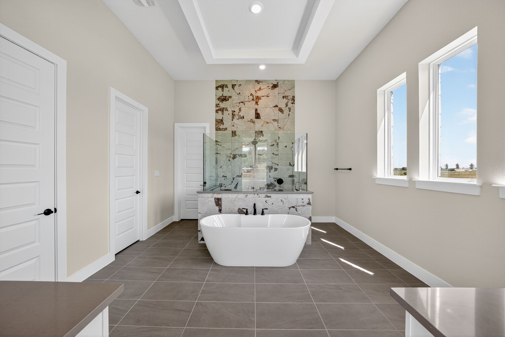 205 Three Rivers Road Georgetown, TX 78633 - Photo 13 of 32 a bathroom with a bathtub and window