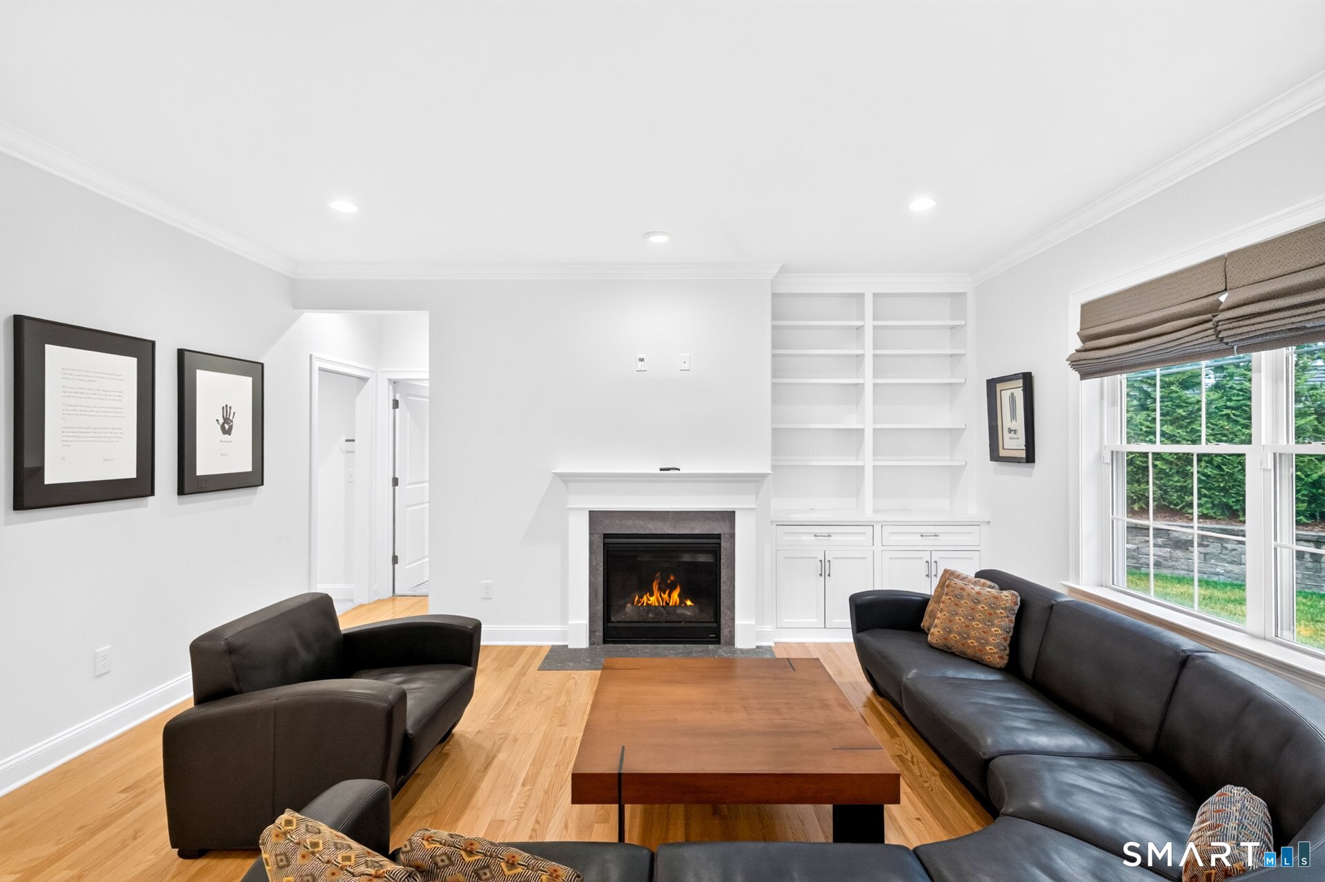 6 Prospect Ridge, Unit 6 Simsbury, CT 06070 - Photo 14 of 33 Built-ins flank one side of the fireplace